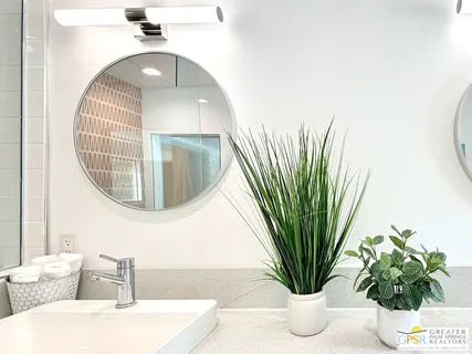 a white bench sitting in a kitchen next to a road