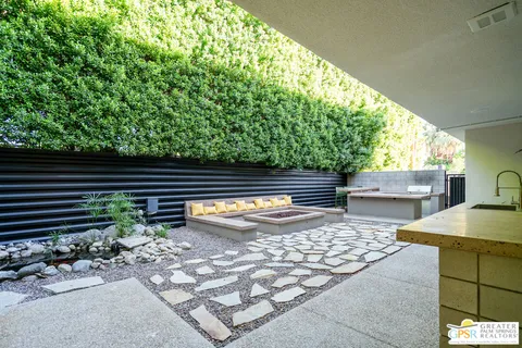 a view of a swimming pool with outdoor seating