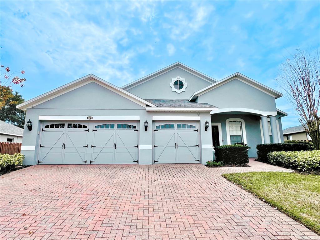 209 Wekiva Pointe Circle Apopka, FL 32712 - Photo 1 of 1 a front view of a house with a yard and garage