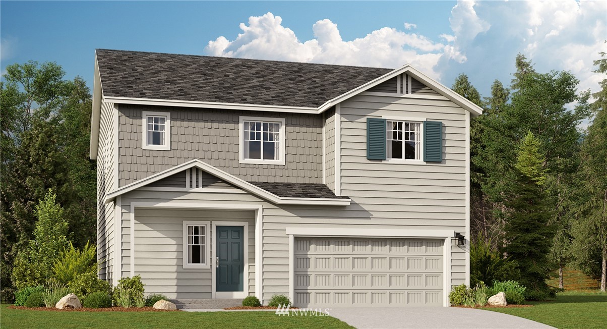 931 Bryant Road, Unit 305 Sultan, WA 98294 - Photo 1 of 3 a front view of a house with a yard
