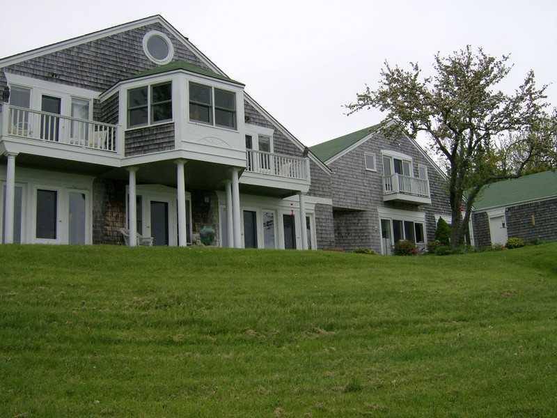19 Mayo Point Road Castine, ME 04421 - Photo 6 of 34 Exterior Back. Land slopes gently to...