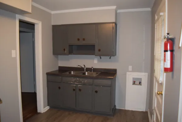 a kitchen with a sink and a stove