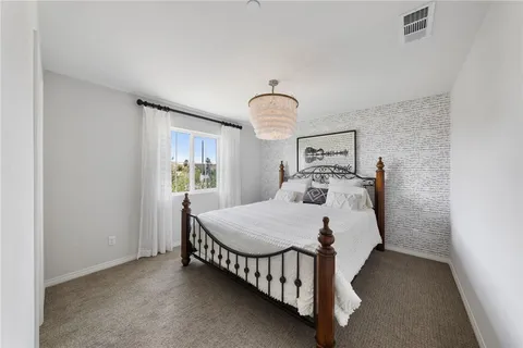 a spacious bathroom with a double vanity sink a mirror and a bathtub