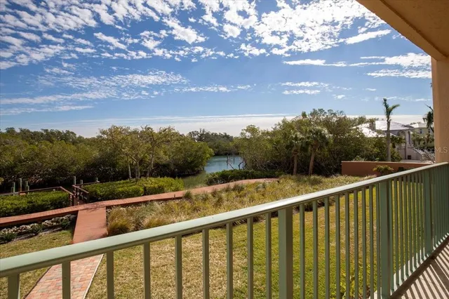 a view of an empty room and window ceiling fan