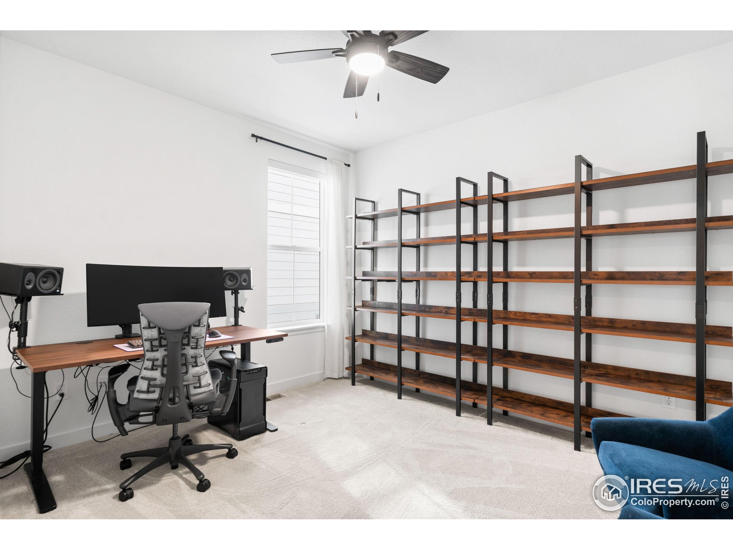 840 Clover Loop Lafayette, CO 80026 - Photo 27 of 39 a workspace with furniture and a window
