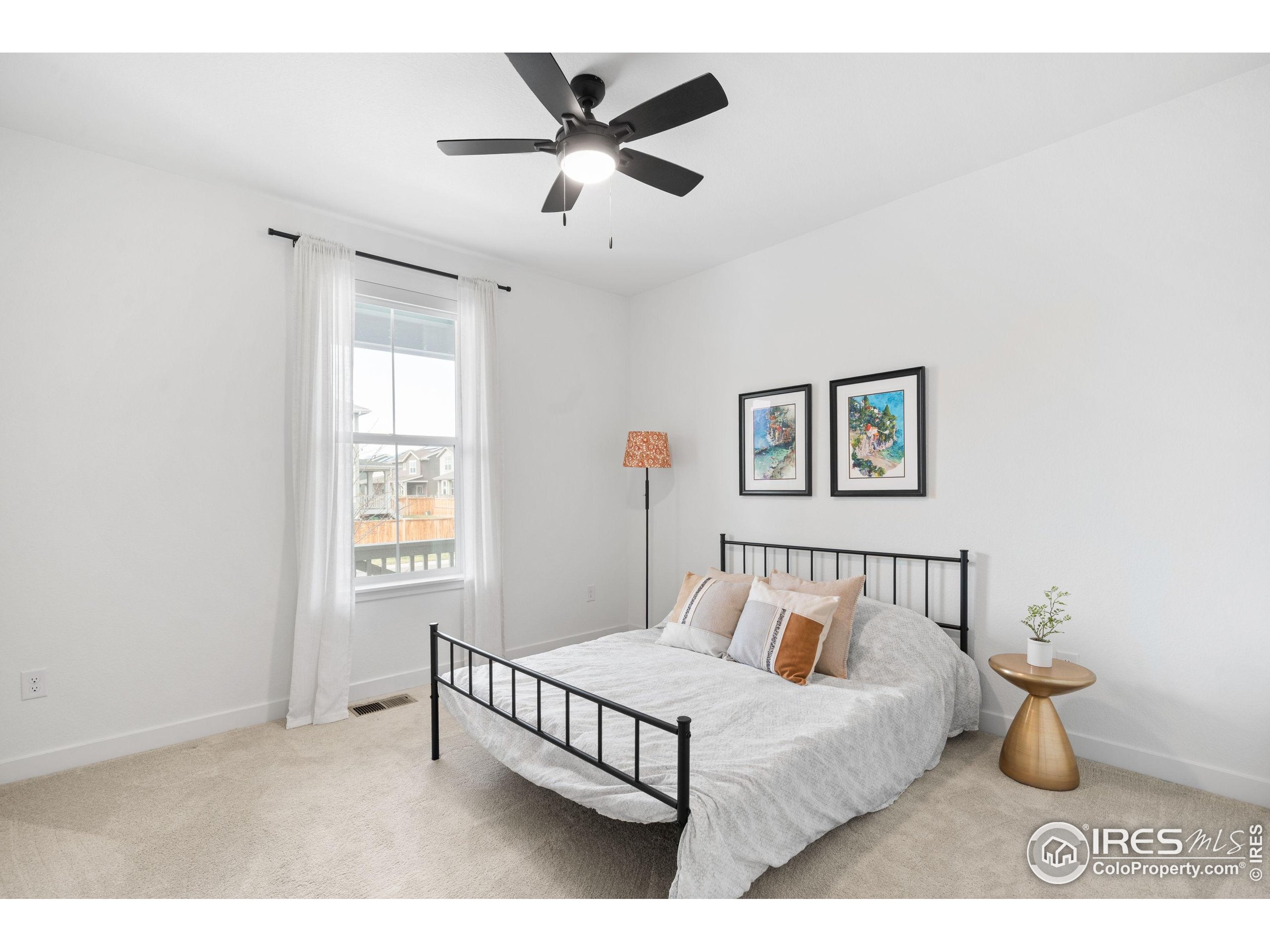 840 Clover Loop Lafayette, CO 80026 - Photo 29 of 39 a bedroom with a bed and a window