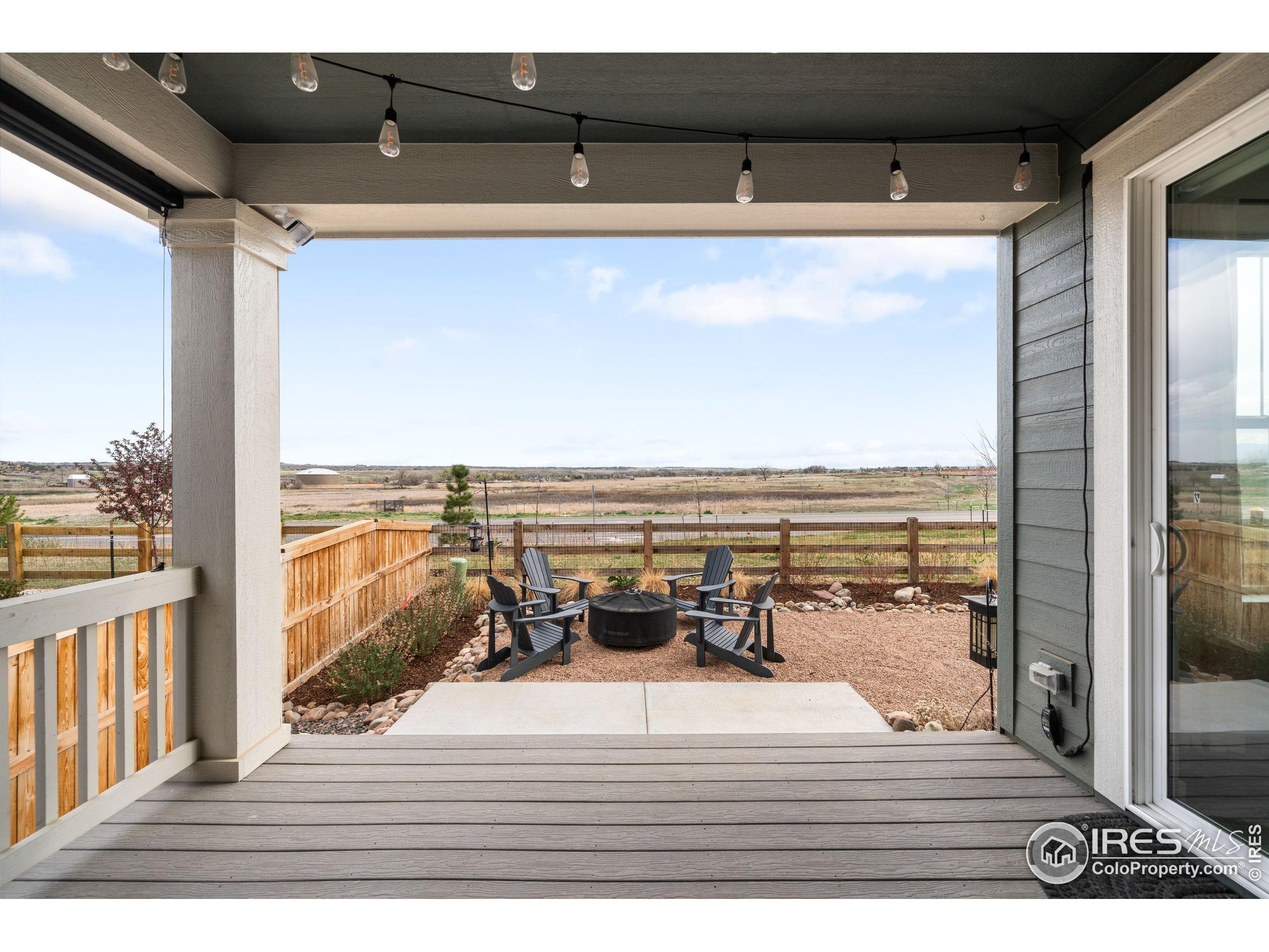 840 Clover Loop Lafayette, CO 80026 - Photo 32 of 39 a view of a balcony with wooden floor and outdoor space