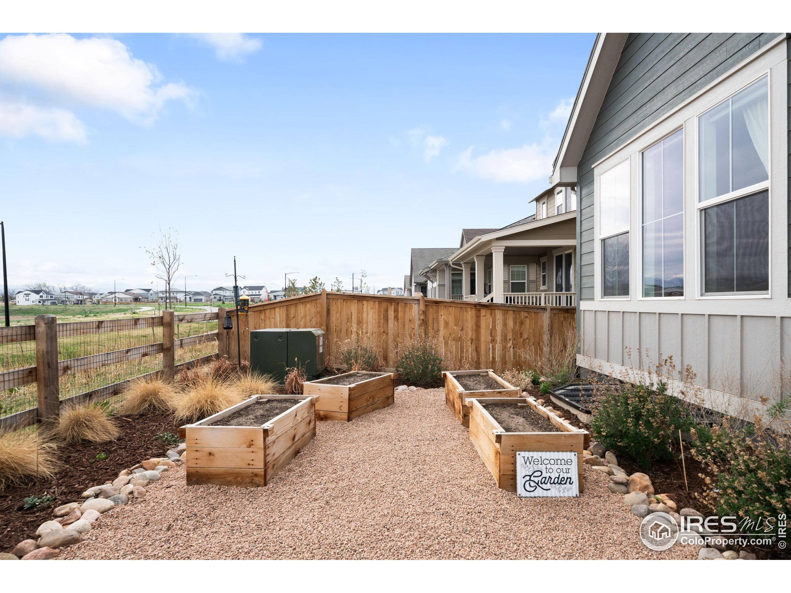 840 Clover Loop Lafayette, CO 80026 - Photo 34 of 39 a backyard of a house with table and chairs