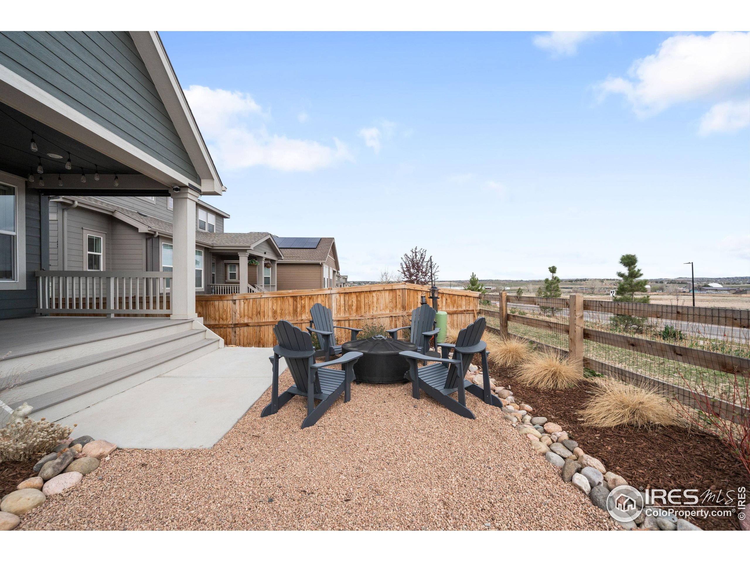 840 Clover Loop Lafayette, CO 80026 - Photo 35 of 39 a terrace of a house with outdoor seating