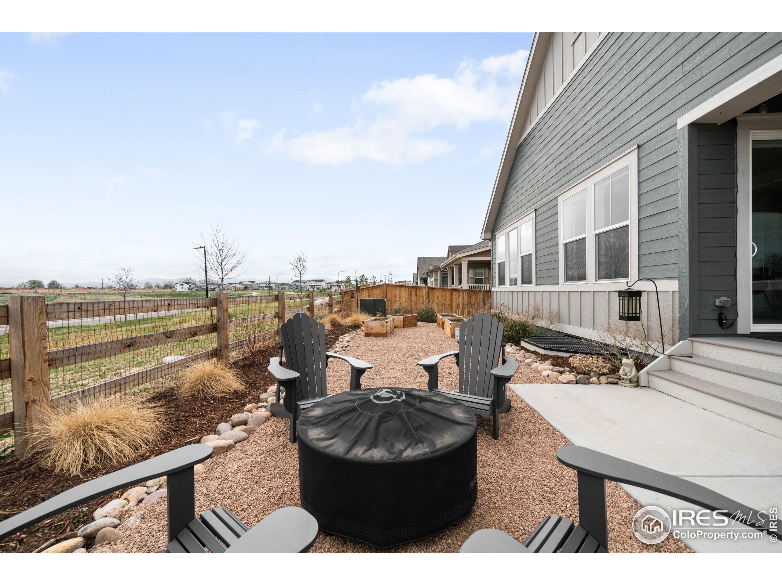 840 Clover Loop Lafayette, CO 80026 - Photo 36 of 39 a view of a terrace with two chairs and a table