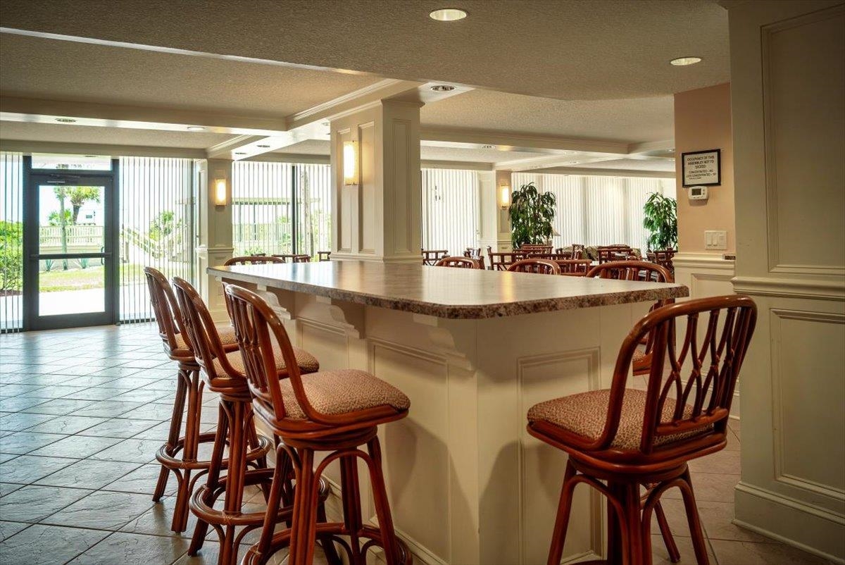2 Dondanville Road, Unit 115 St. Augustine, FL 32080 - Photo 22 of 36 a dining room with furniture window and wooden floor