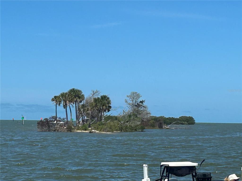 38 65th Street Yankeetown, FL 34498 - Photo 11 of 15 a view of a lake with a mountain in the background