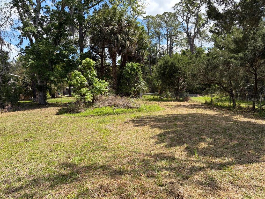 38 65th Street Yankeetown, FL 34498 - Photo 3 of 15 a view of a yard with yellow lighting