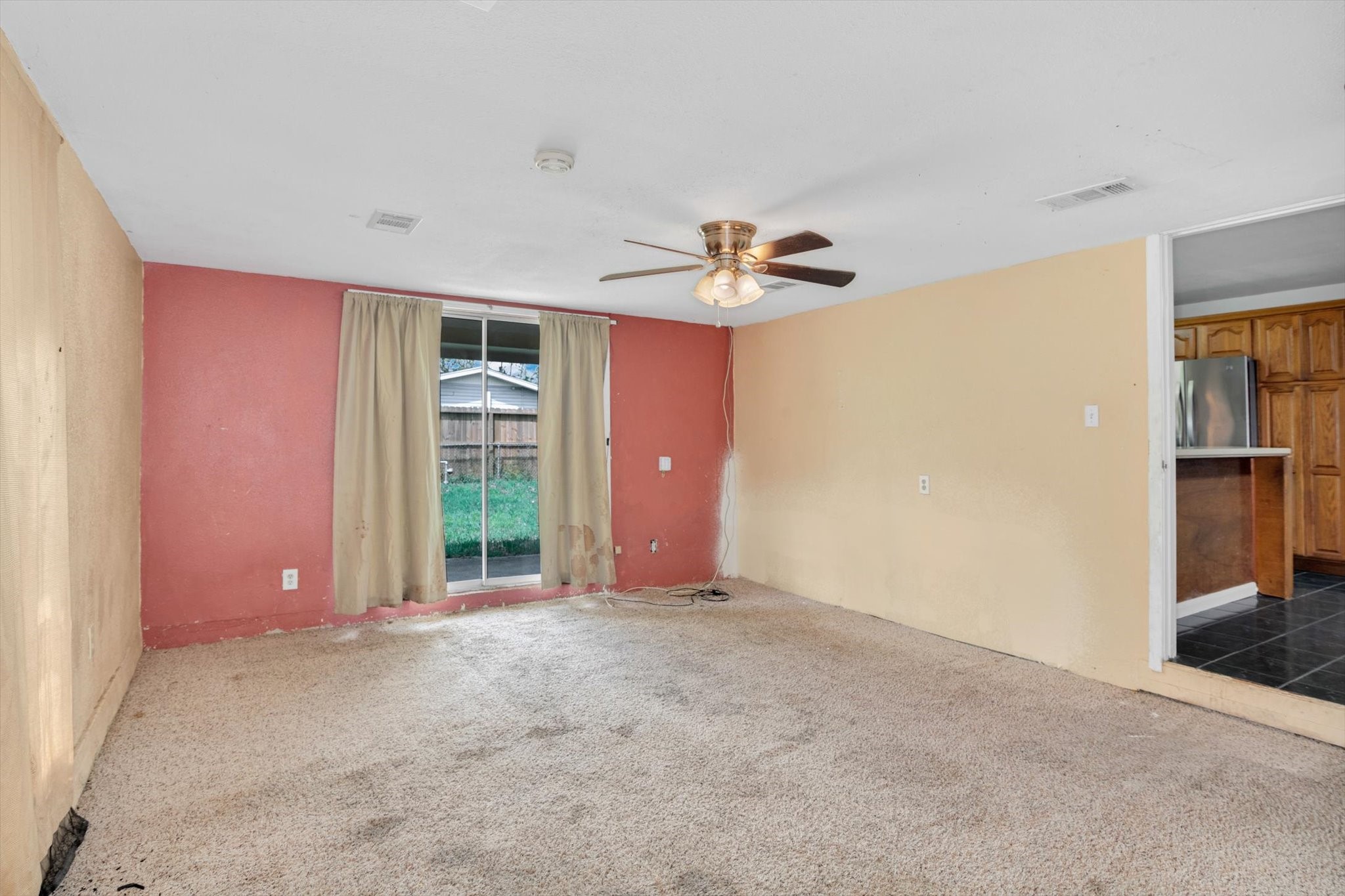 406 Red Ripple Road Houston, TX 77091 - Photo 15 of 37 a view of a livingroom with a chandelier fan and wooden floor