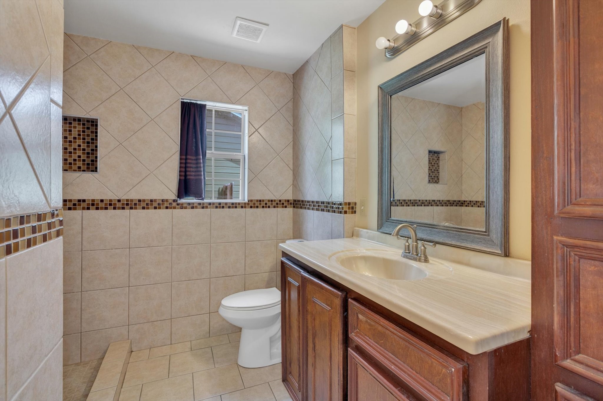 406 Red Ripple Road Houston, TX 77091 - Photo 20 of 37 a bathroom with a sink and a mirror
