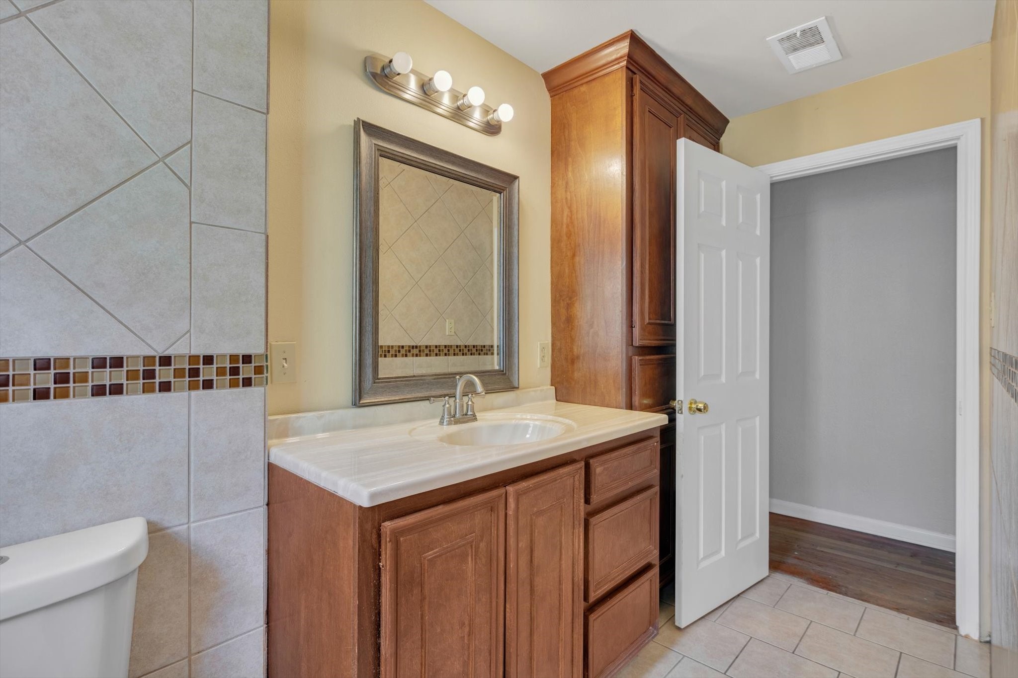 406 Red Ripple Road Houston, TX 77091 - Photo 21 of 37 a bathroom with a sink and a mirror