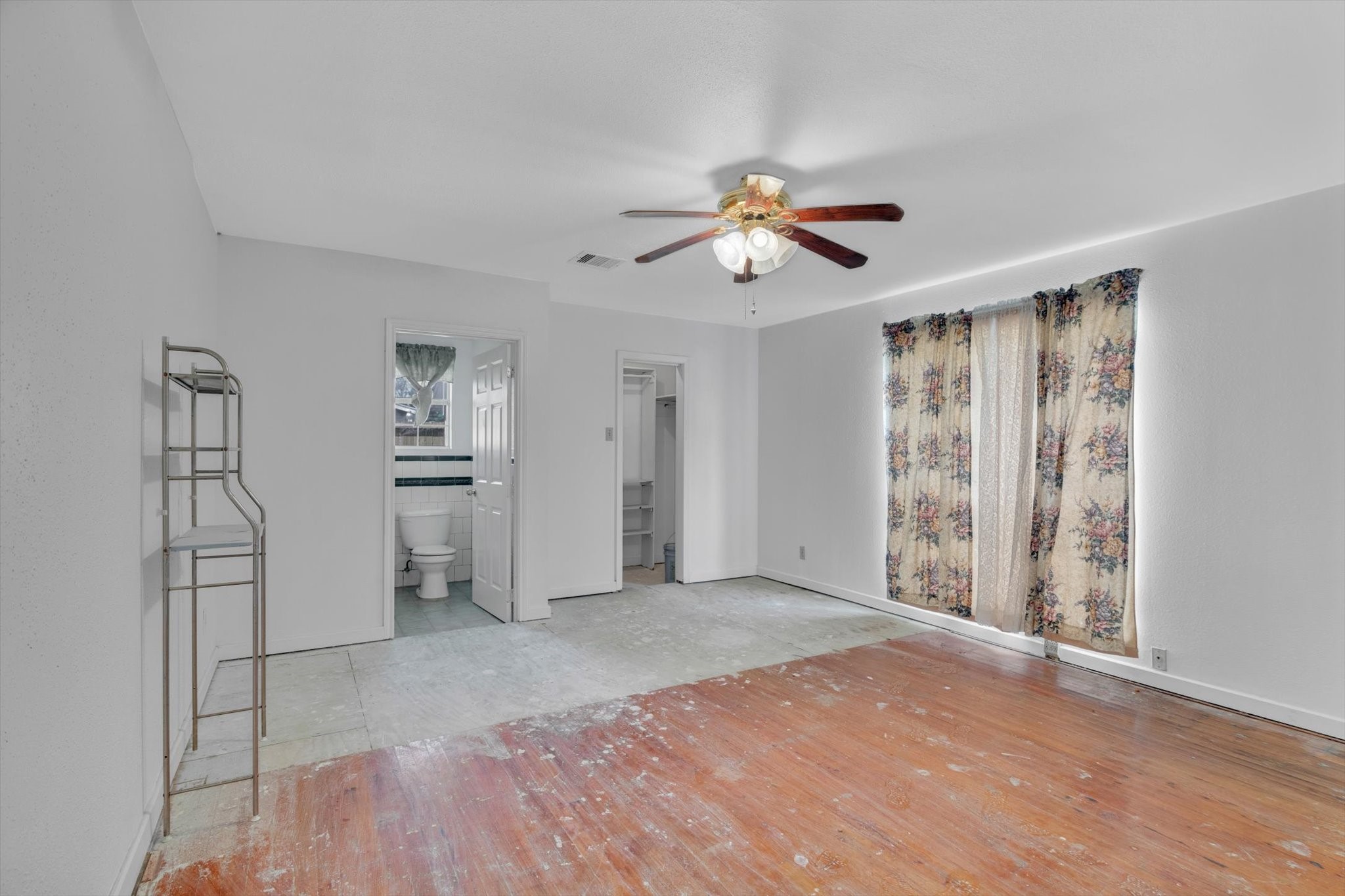 406 Red Ripple Road Houston, TX 77091 - Photo 25 of 37 wooden floor in an empty room with a window