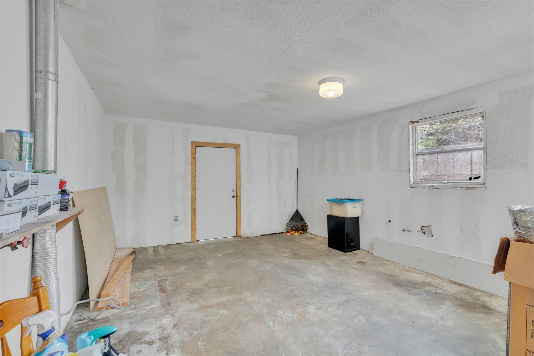 406 Red Ripple Road Houston, TX 77091 - Photo 31 of 37 a view of a storage & utility room with a window
