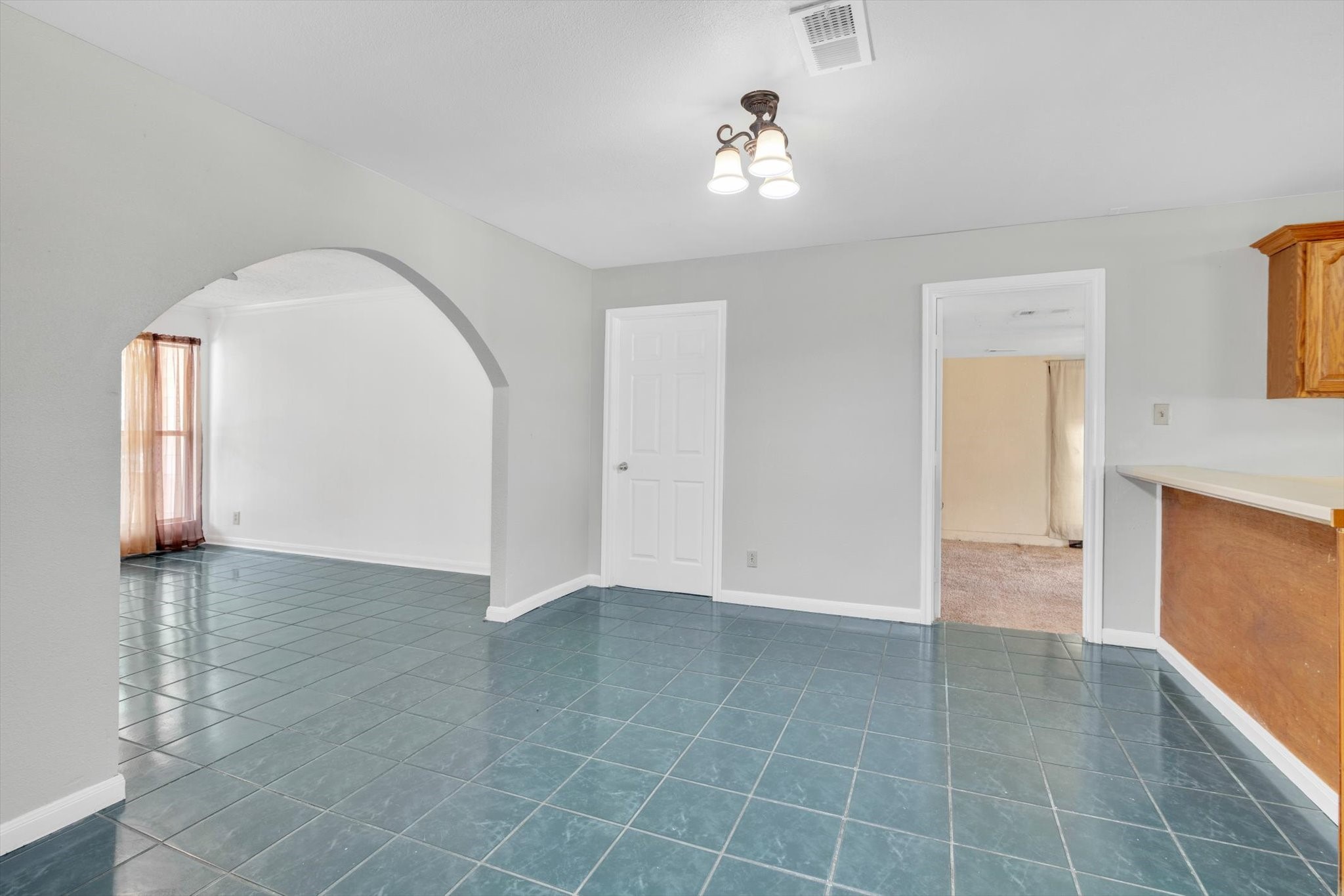 406 Red Ripple Road Houston, TX 77091 - Photo 10 of 37 a view of an empty room with window and wooden floor