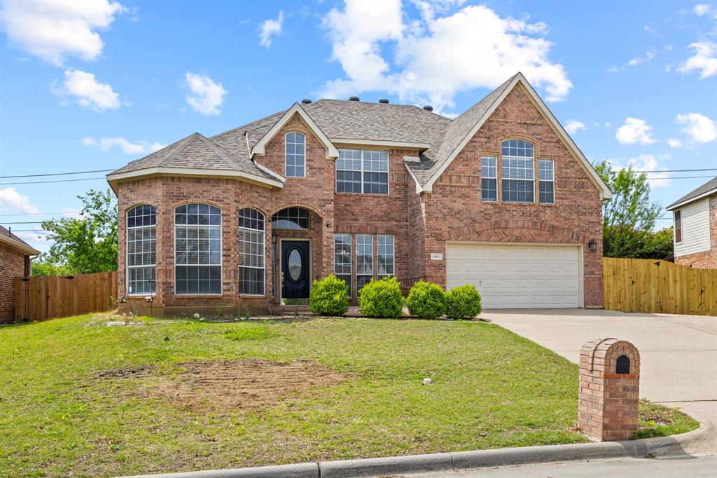 1904 Meera Lane Mansfield, TX 76063 - Photo 2 of 35 a front view of a house with garden