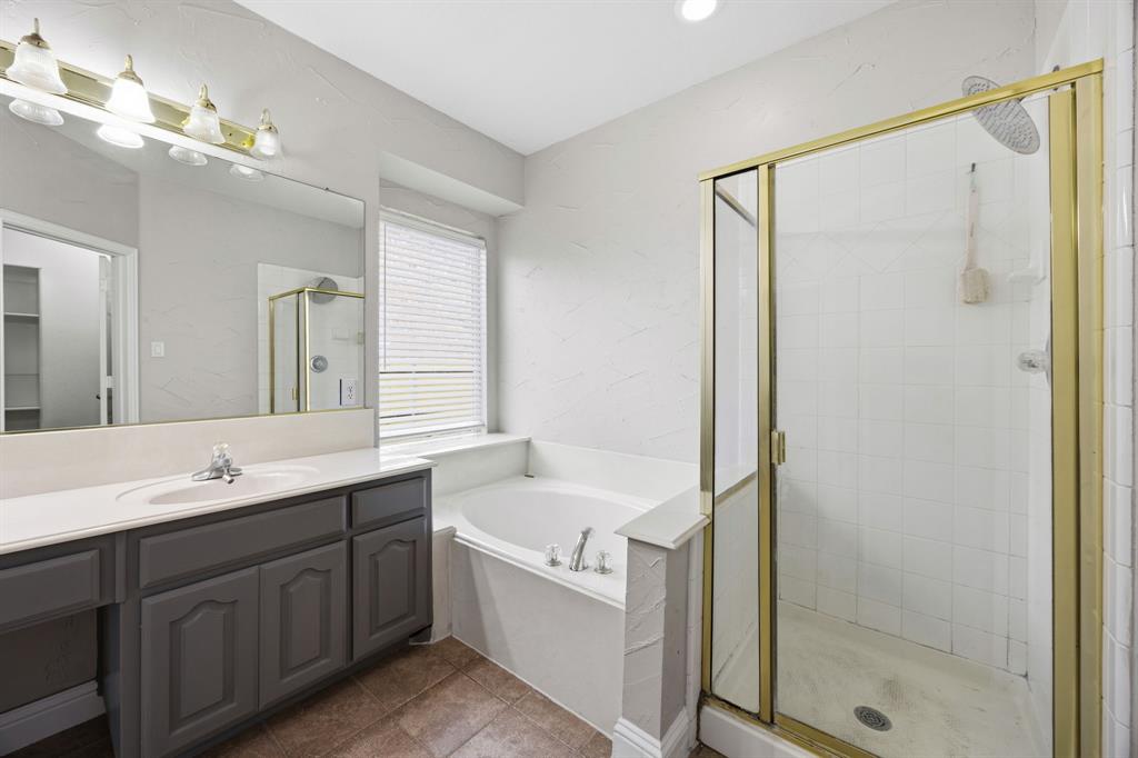 1904 Meera Lane Mansfield, TX 76063 - Photo 25 of 35 a bathroom with a double vanity sink mirror and shower