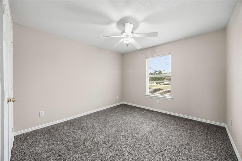 1904 Meera Lane Mansfield, TX 76063 - Photo 29 of 35 an empty room with windows and fan