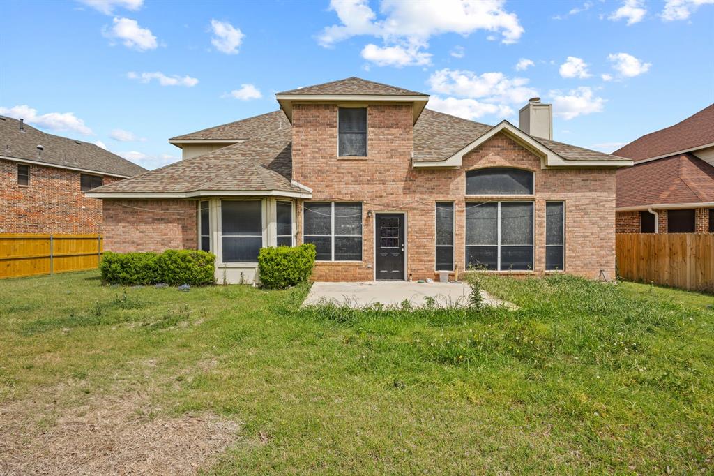 1904 Meera Lane Mansfield, TX 76063 - Photo 34 of 35 a front view of a house with yard and green space