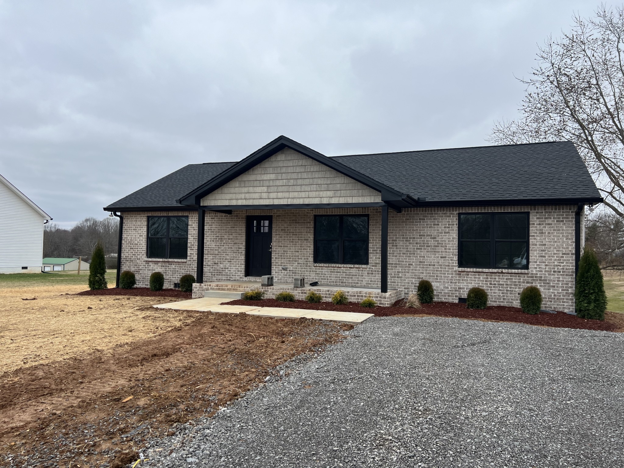1669 New Deal Potts Road Portland, TN 37148 - Photo 1 of 17 a front view of a house with sitting area and seating space