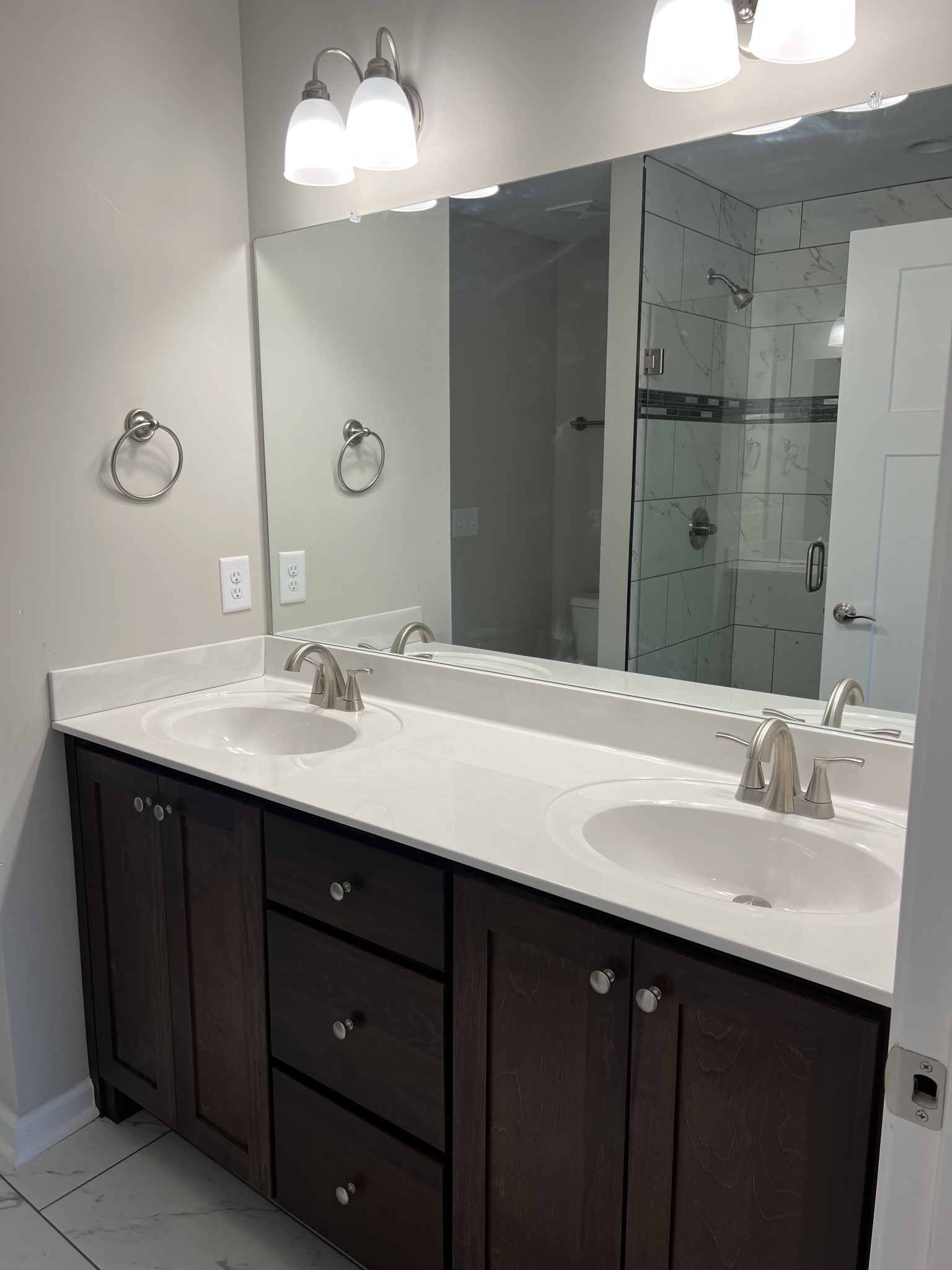 1669 New Deal Potts Road Portland, TN 37148 - Photo 11 of 17 a bathroom with a double vanity sink mirror and shower