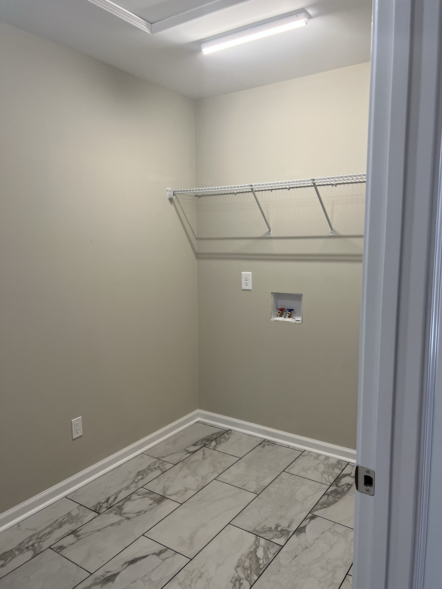 1669 New Deal Potts Road Portland, TN 37148 - Photo 2 of 17 a view of a room with racks on the wall