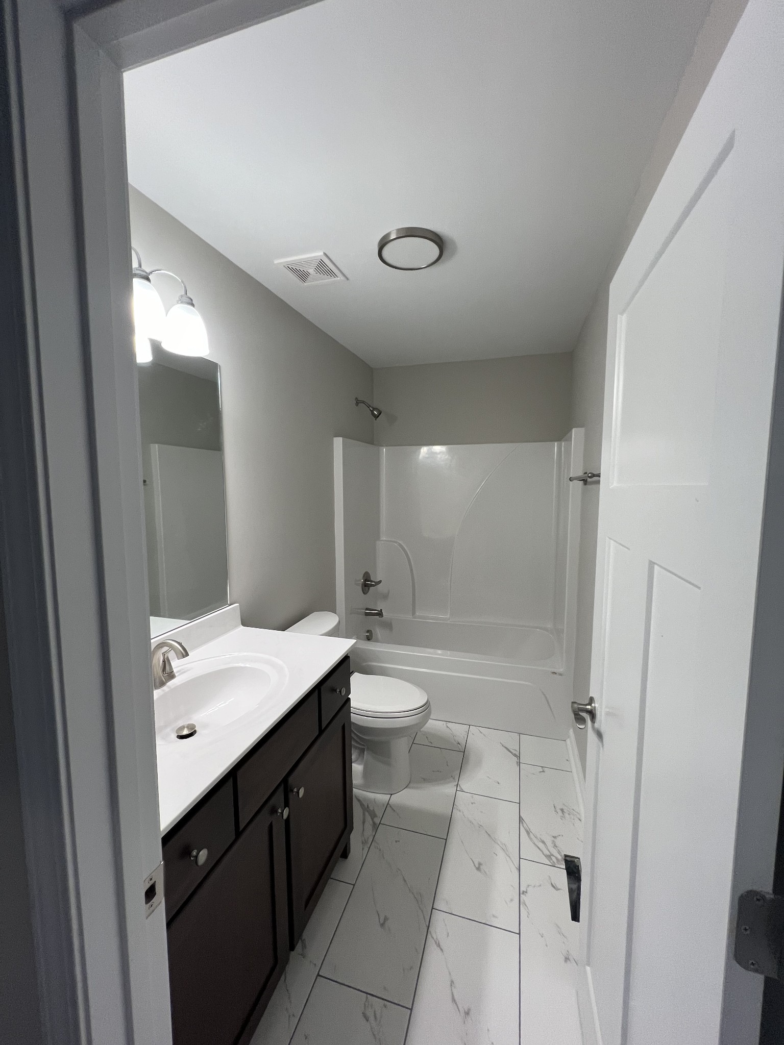 1669 New Deal Potts Road Portland, TN 37148 - Photo 7 of 17 a spacious bathroom with a granite countertop sink a toilet and shower
