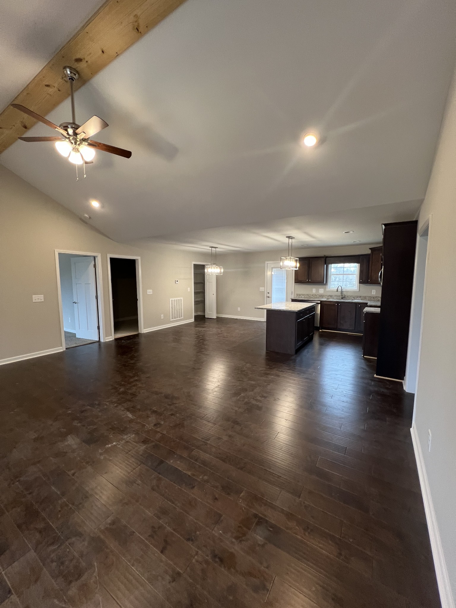 1669 New Deal Potts Road Portland, TN 37148 - Photo 8 of 17 an empty room with wooden floor fireplace and window