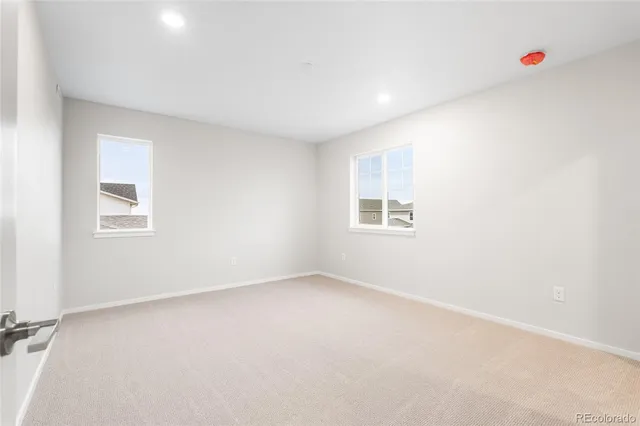 an empty room with windows