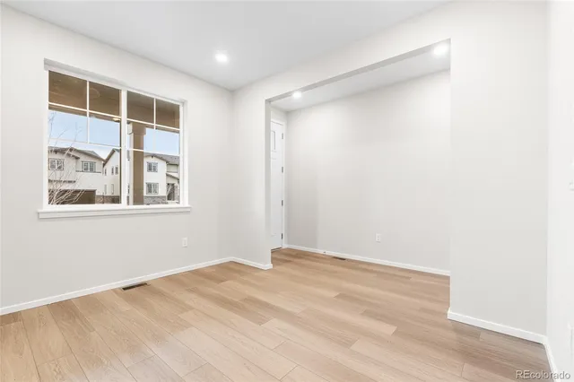 a view of empty room with windows