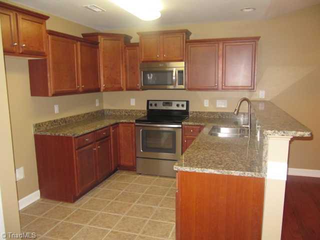 115 Ridge Landing Road Archdale, NC 27263 - Photo 5 of 16 Kitchen. Granite Counters, Stainless Appliances