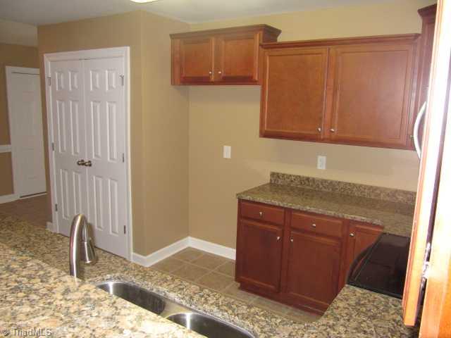115 Ridge Landing Road Archdale, NC 27263 - Photo 7 of 16 Kitchen. Ceramic Tile Floor, Pantry