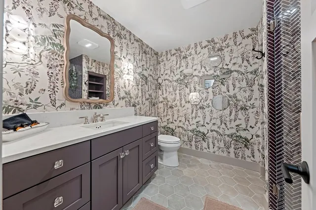 a bed room with a bed and a lamp