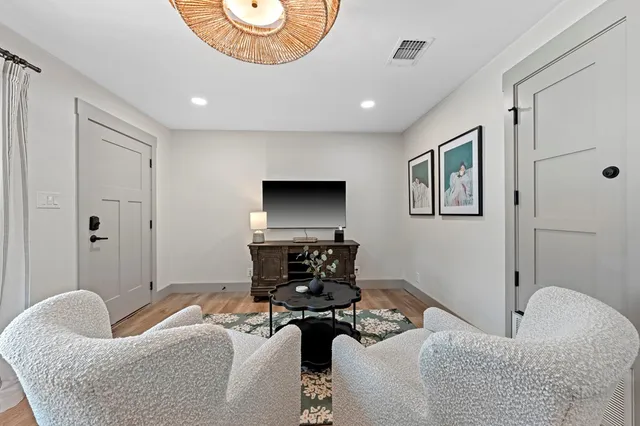 a bedroom with a bed and cabinets