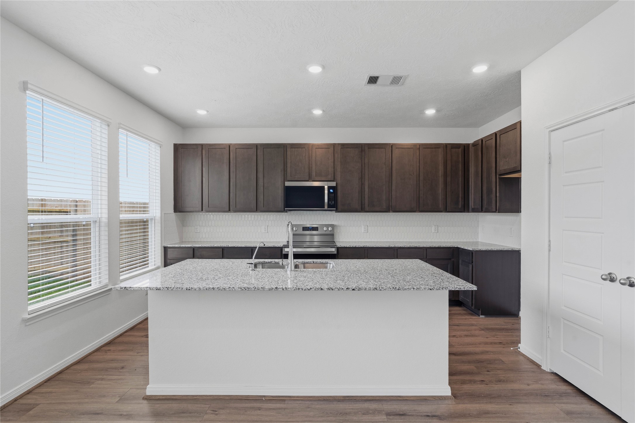 2503 Spruce Hl Road Beasley, TX 77417 - Photo 13 of 31 This spacious kitchen has it all—ample storage, generous counter space, and a layout that truly makes it the heart of the home.
