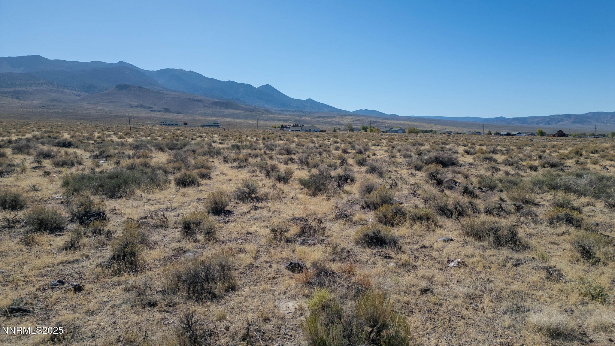 255 Como Lane Dayton, NV 89403 - Photo 15 of 15 a view of a lush green hillside and a building