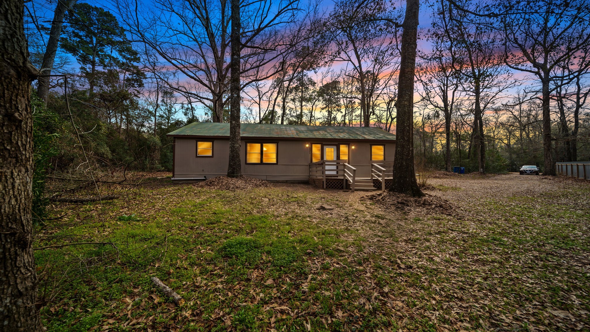 2363 Virginia Avenue Montgomery, TX 77316 - Photo 1 of 19 a front view of a house with a yard