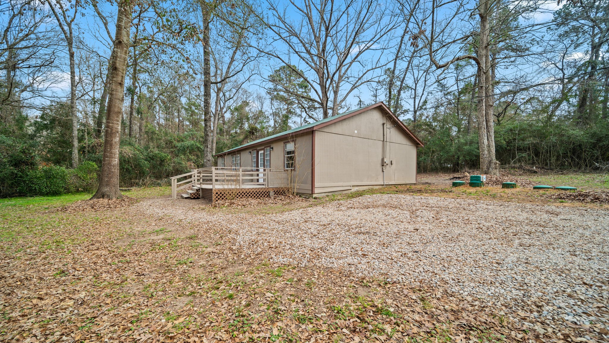 2363 Virginia Avenue Montgomery, TX 77316 - Photo 3 of 19 a house with trees in the background
