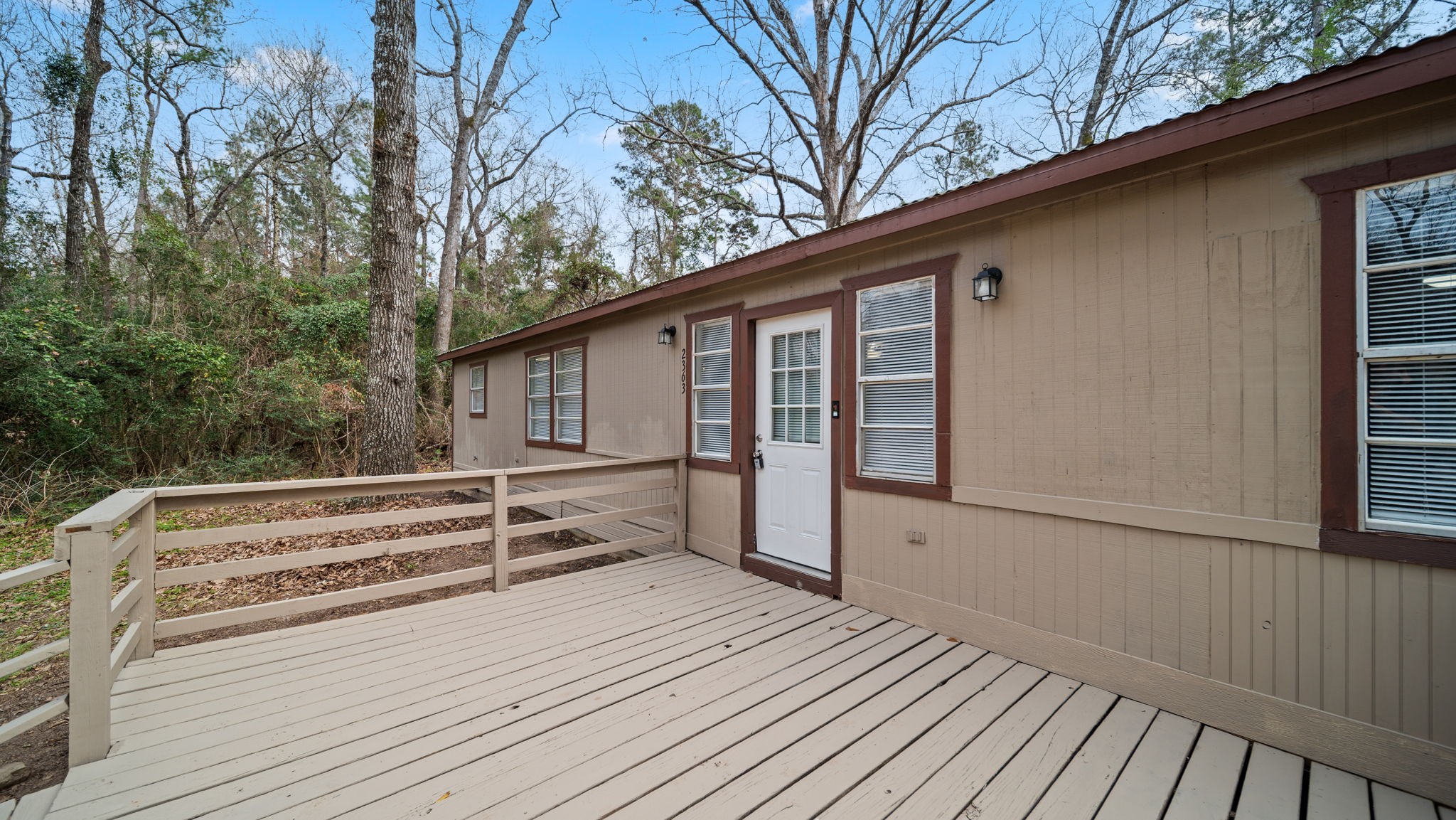 2363 Virginia Avenue Montgomery, TX 77316 - Photo 5 of 19 a view of a house with a roof deck