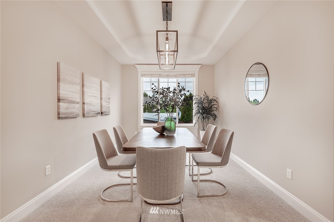751 Duvall Place Northeast Renton, WA 98059 - Photo 8 of 40 a dining room with furniture a chandelier and window