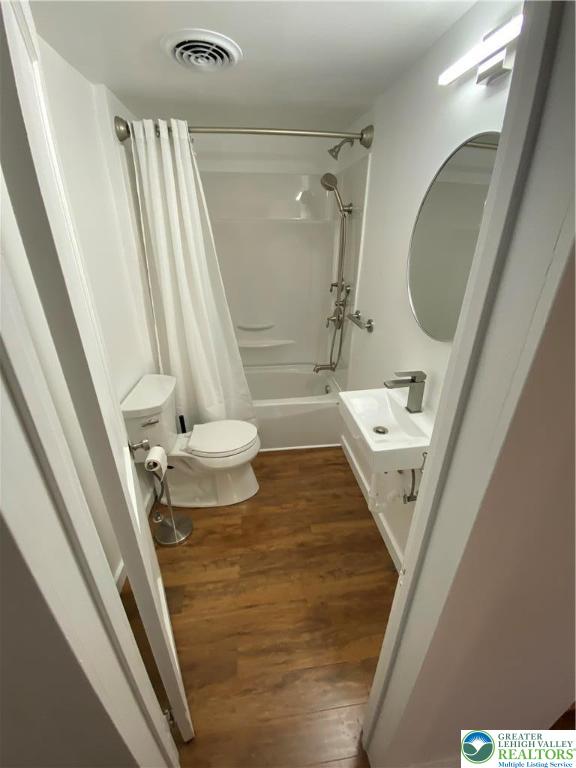 16 South 3rd Street, Unit 1 Emmaus, PA 18049 - Photo 12 of 12 a bathroom with a sink a mirror and toilet