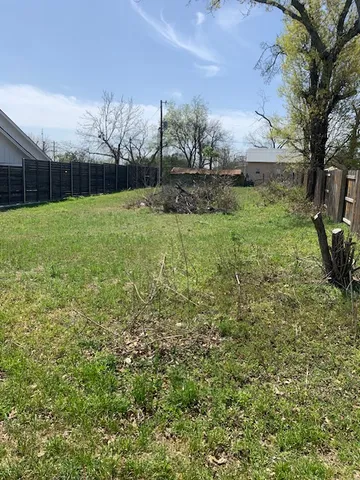 a view of backyard with entertaining space