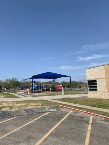 a view of a building with a street
