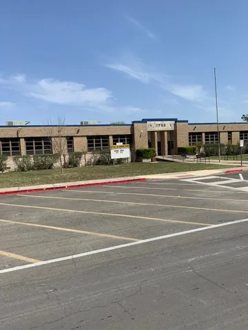 a view of a building and a yard