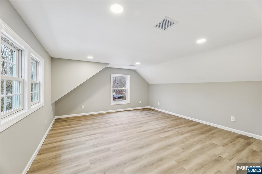 448 Morsetown Road West Milford, NJ 07480 - Photo 16 of 27 a view of an empty room with wooden floor and a window