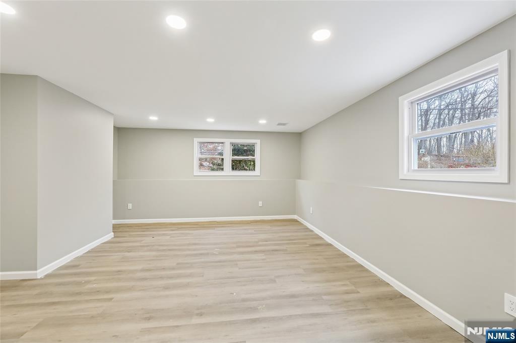 448 Morsetown Road West Milford, NJ 07480 - Photo 20 of 27 a view of an empty room with wooden floor and a window